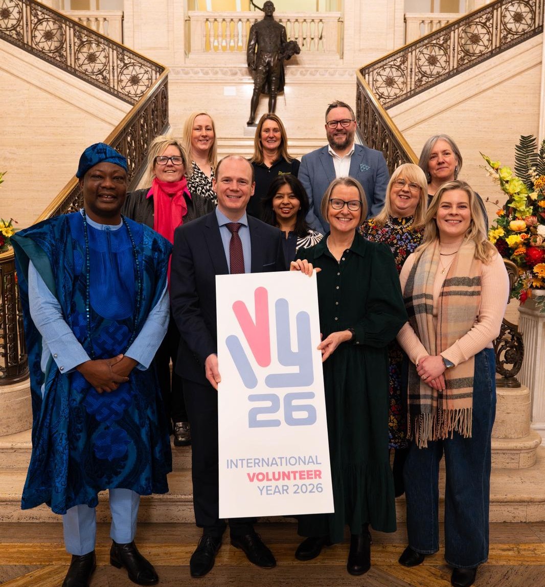 Communities Minister Gordon Lyons pictured with members of the Working Group on the steps inside Stormont's Parliament Buildings