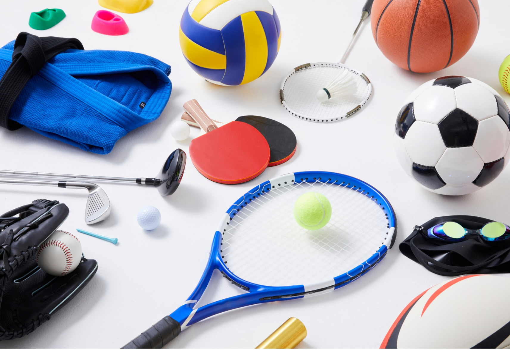 Lots of sports equipment including tennis and table tennis racquets, balls, golf club, judo outfit